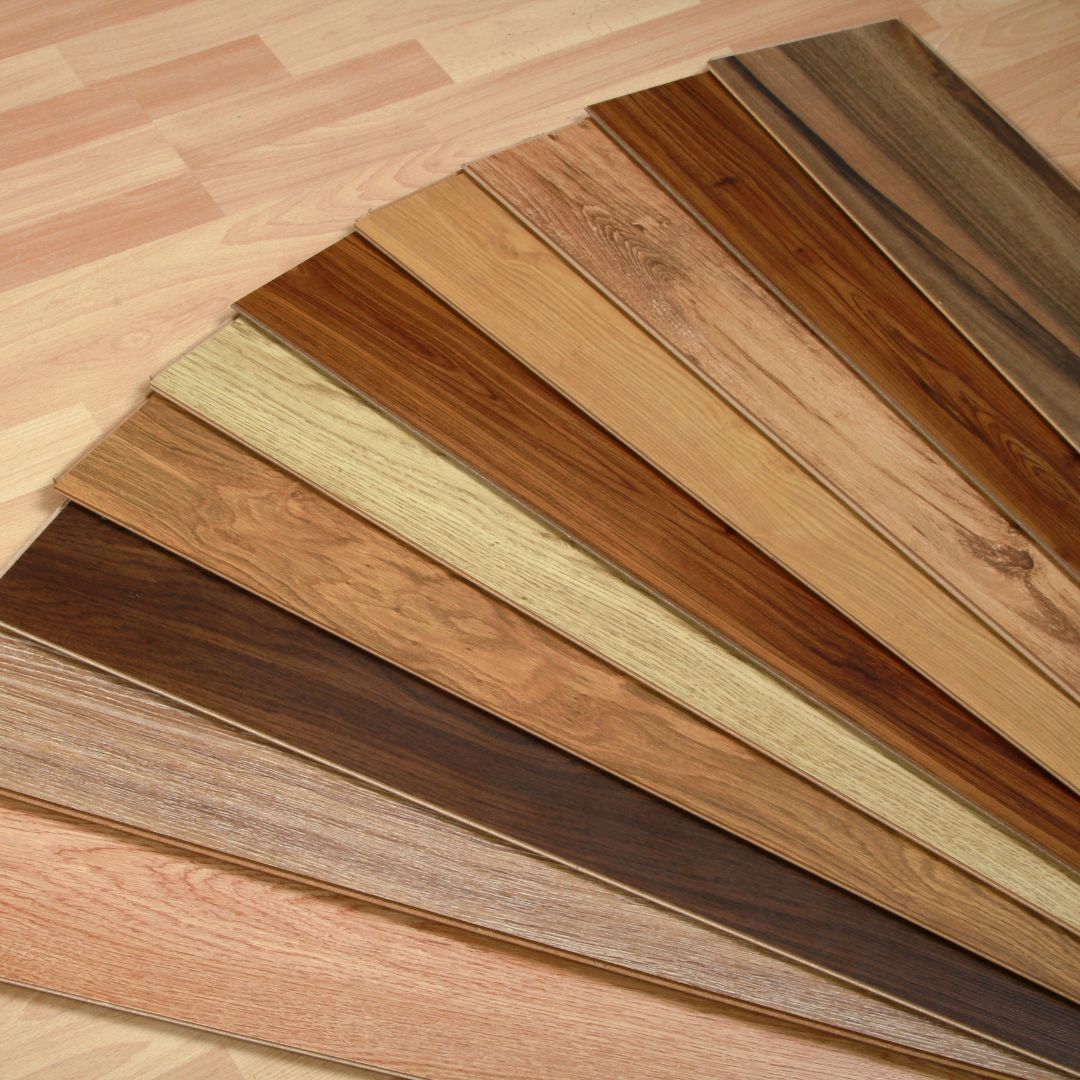 Various wood flooring samples in different colors and wood grain patterns
